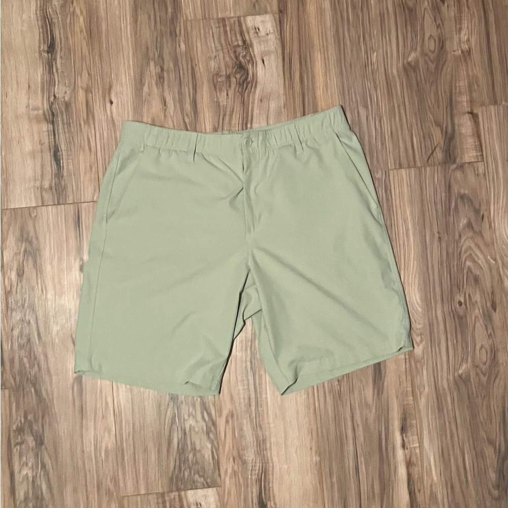 Three Under Armour khaki flat front shorts